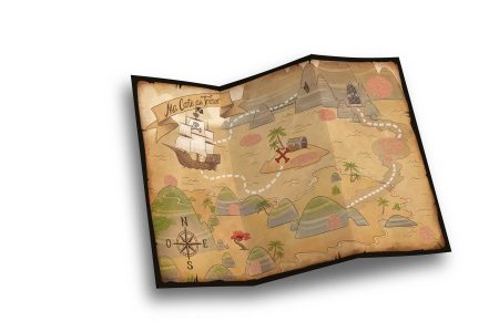 Folded sheets of white paper on dark wooden background